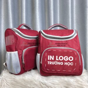 Balo học sinh chống gù màu đỏ đô